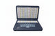 A digital educational device with a keyboard and screen, displaying rows of text which seem to be verses from the Quran, placed in an open position.