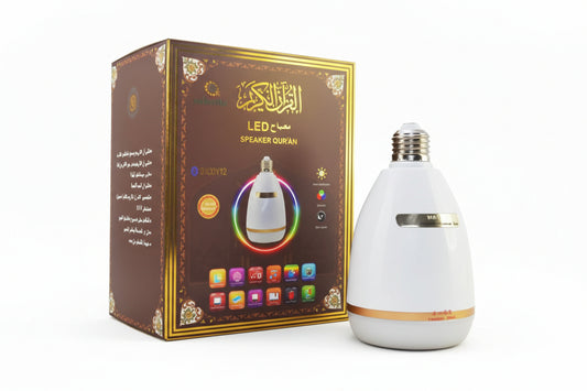 A white cylindrical speaker with multicolored light rings on top, displayed next to its packaging box which has Arabic text and decorative elements.